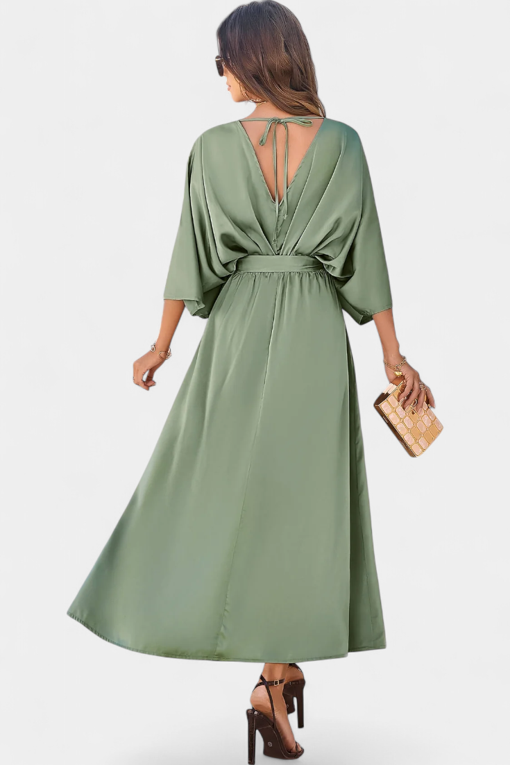 Elegantes Kleid von Milly mit Schleife und Öffnung